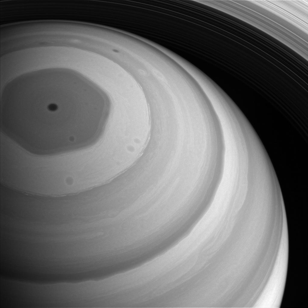 Saturn's remarkable hexagonal cloud pattern at the north pole, showing geometric vortex formation